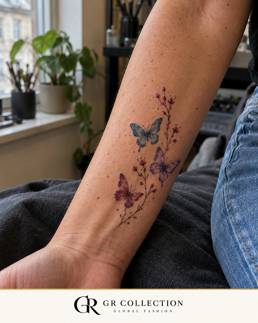 GR Collection design concept: blue, lilac and burgundy butterflies with fine wildflowers on a forearm.