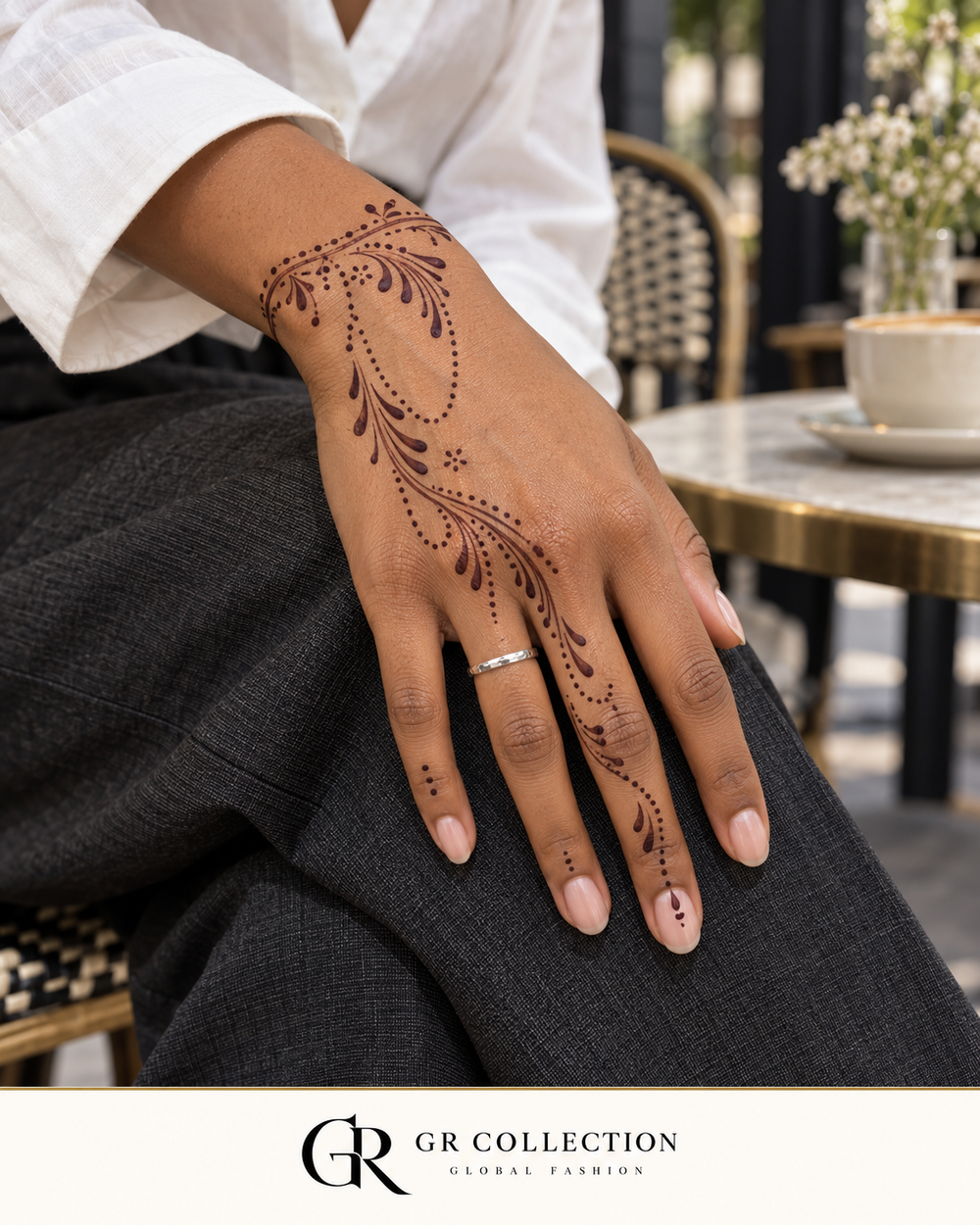 GR Collection design concept: flowing dotted mehndi and teardrop patterns on a hand.