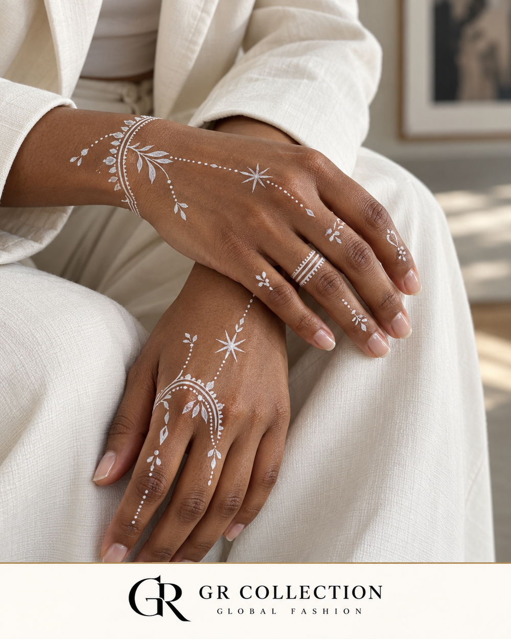 GR Collection design concept: delicate white stars and botanical body art on two hands.