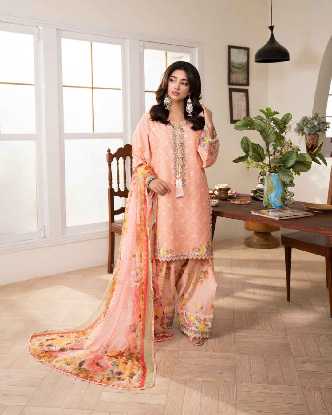 Peach Pakistani three-piece suit with floral details and matching dupatta