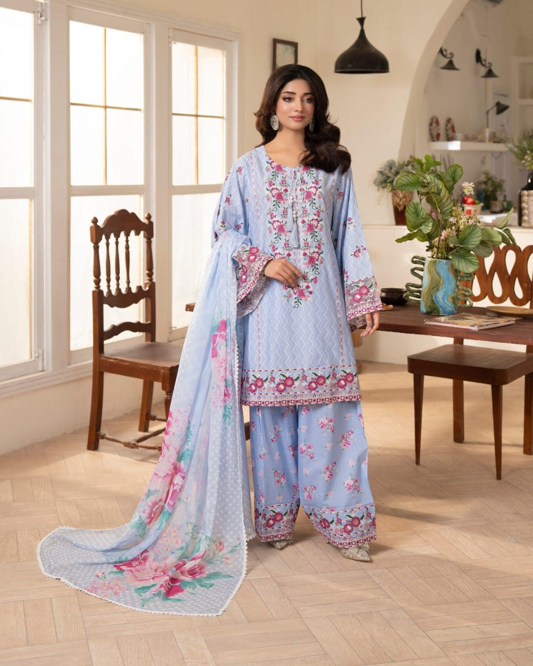 Sky blue Pakistani three-piece suit with floral details and matching dupatta